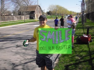 Holding the sign and cheering around the 26km mark of the Mississauga Marathon