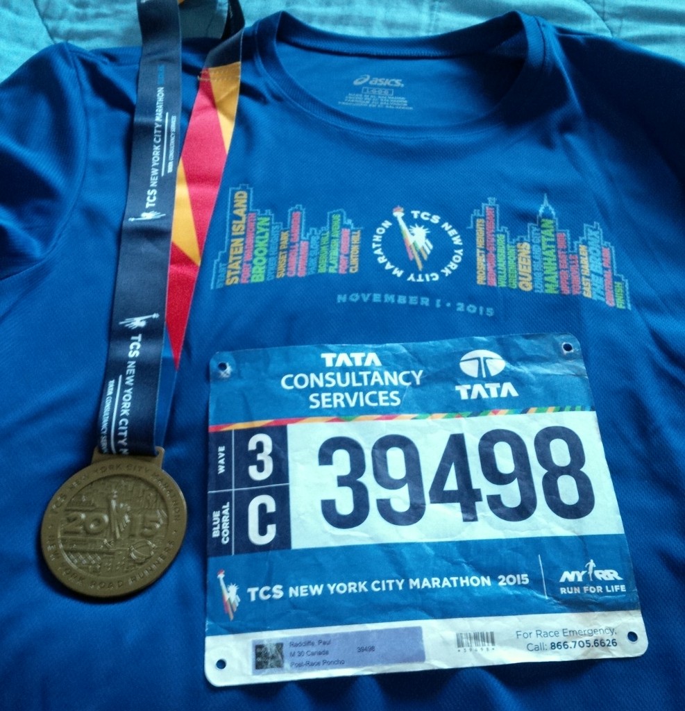 Medal, race shirt, and my race bib
