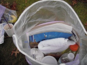 My handy baggie of goodies I scrounged from the hotel, including a water bottle, plastic bags, newspaper, and paper cup with two muffins. Also used as a pillow