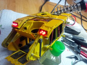 Work in progress on a big yellow tank with lights called a "Land Raider"