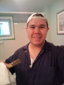 Playing handyman. In this particular picture, painter.