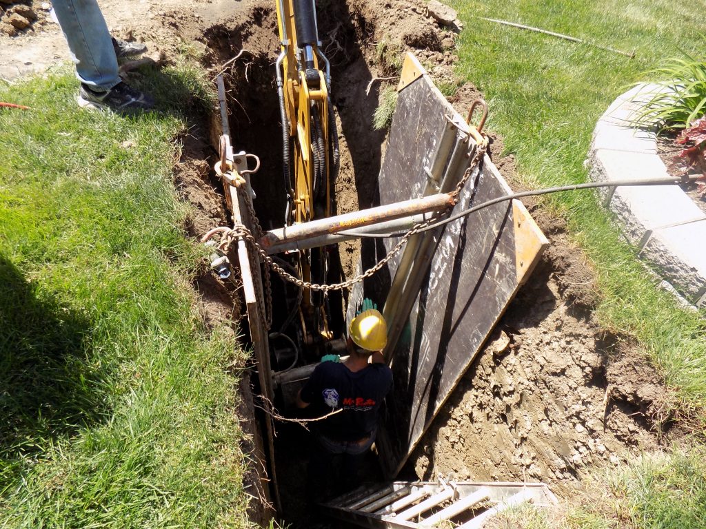 Very large hole in the ground to fix the pipe. Might as well have filled it with money afterwards...