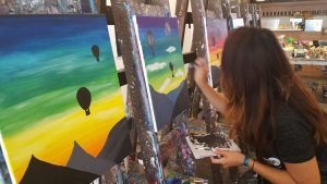 Sharise working on her hot air balloon painting